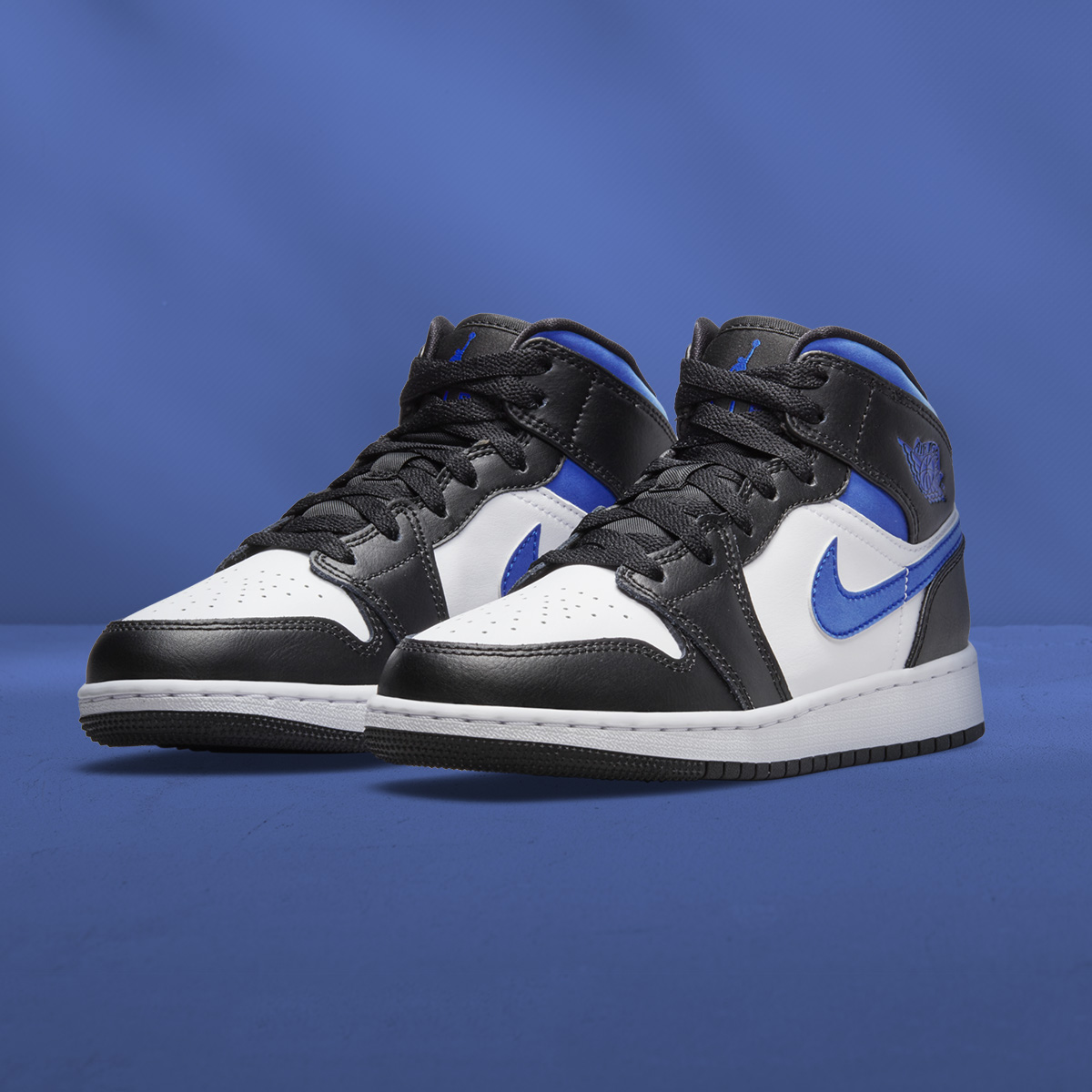 Jordan mid-top in black, white, and royal blue