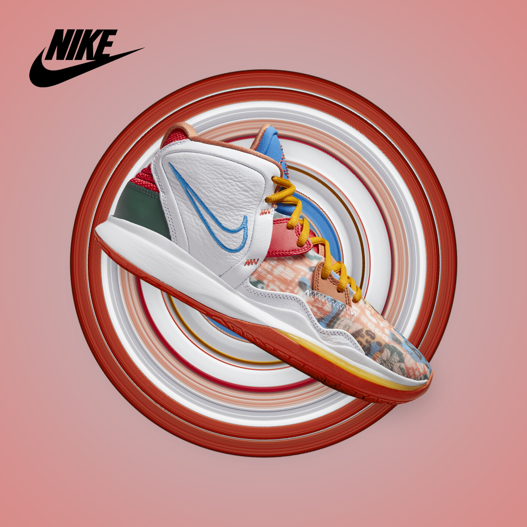 Nike basketball shoe in white, blue, and animal print on a circular striped backdrop